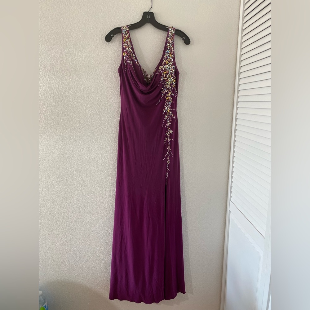Beautiful long violet evening gown crystal accent along the bust and side.